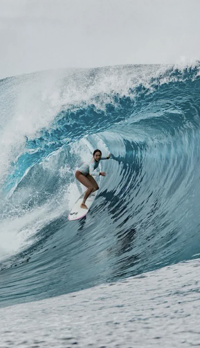 Surfer inside a barrelling wave