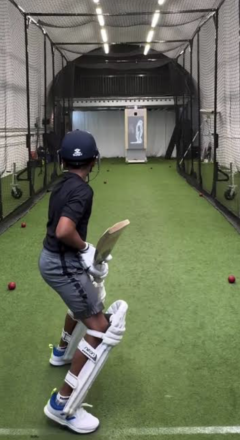 Batter training in an indoor cricket net with a replay monitor
