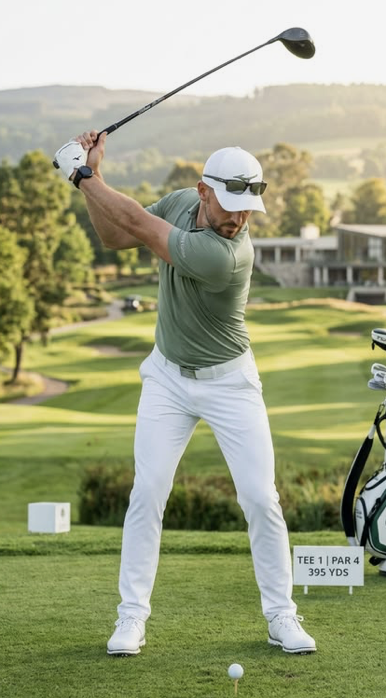 Golfer teeing off at a corporate golf day
